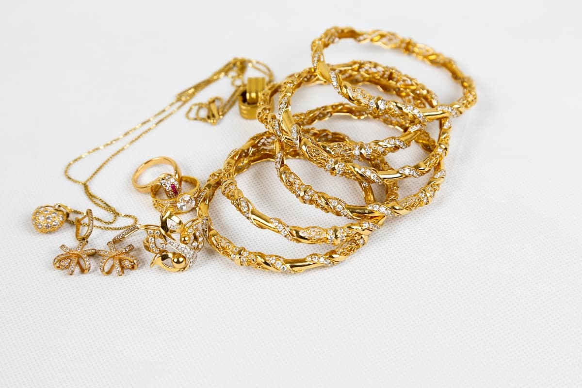 Gold ornaments: bangles, a chain, a ring and earrings