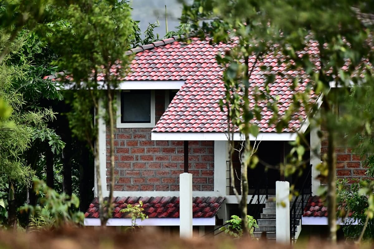 A newly built house with brick walls and a tiled roof